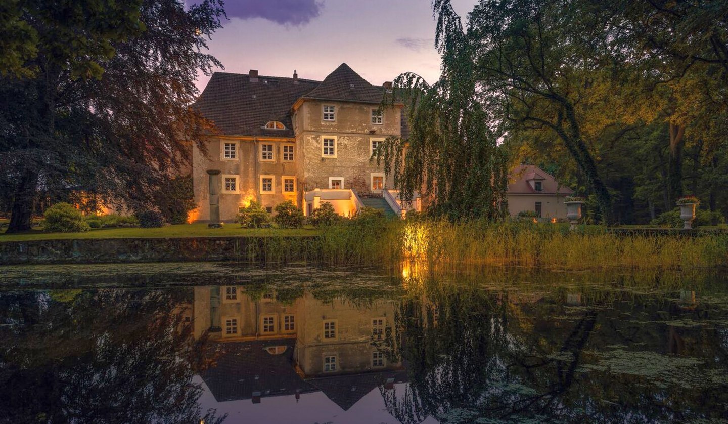 Wasserschloss Mellenthin in der Dämmerung, © Wasserschloss Mellenthin